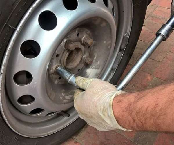 photo of a man Maintain your car change the tires