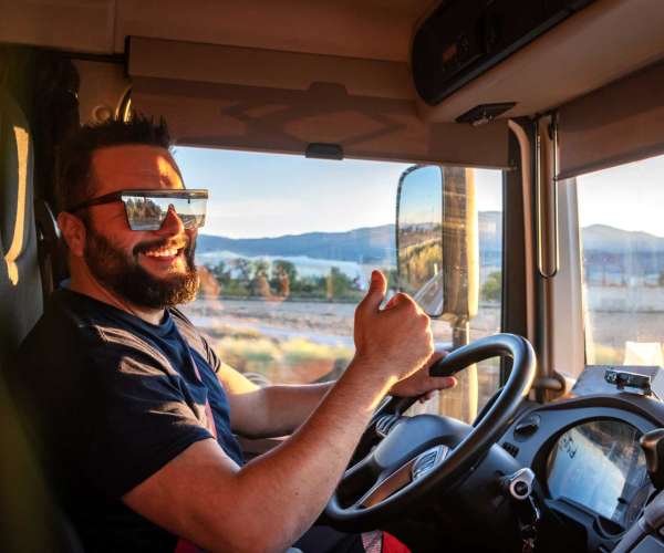 Car Shipping Carrier Driver behind the wheel