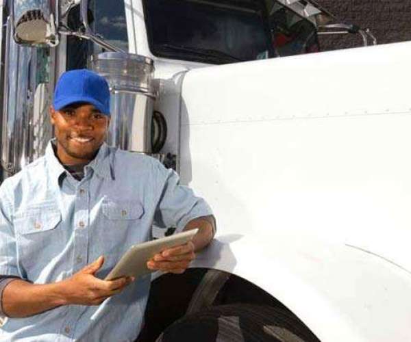 A Houston to Atlanta Car Shipping driver prepares a vehicle for shipment