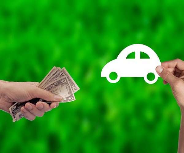 photo of hand with money Sell buy shipping your car