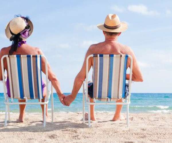 A couple on the beach after summer auto transport