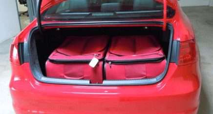 photo of suitcases in trunk of car being shipped